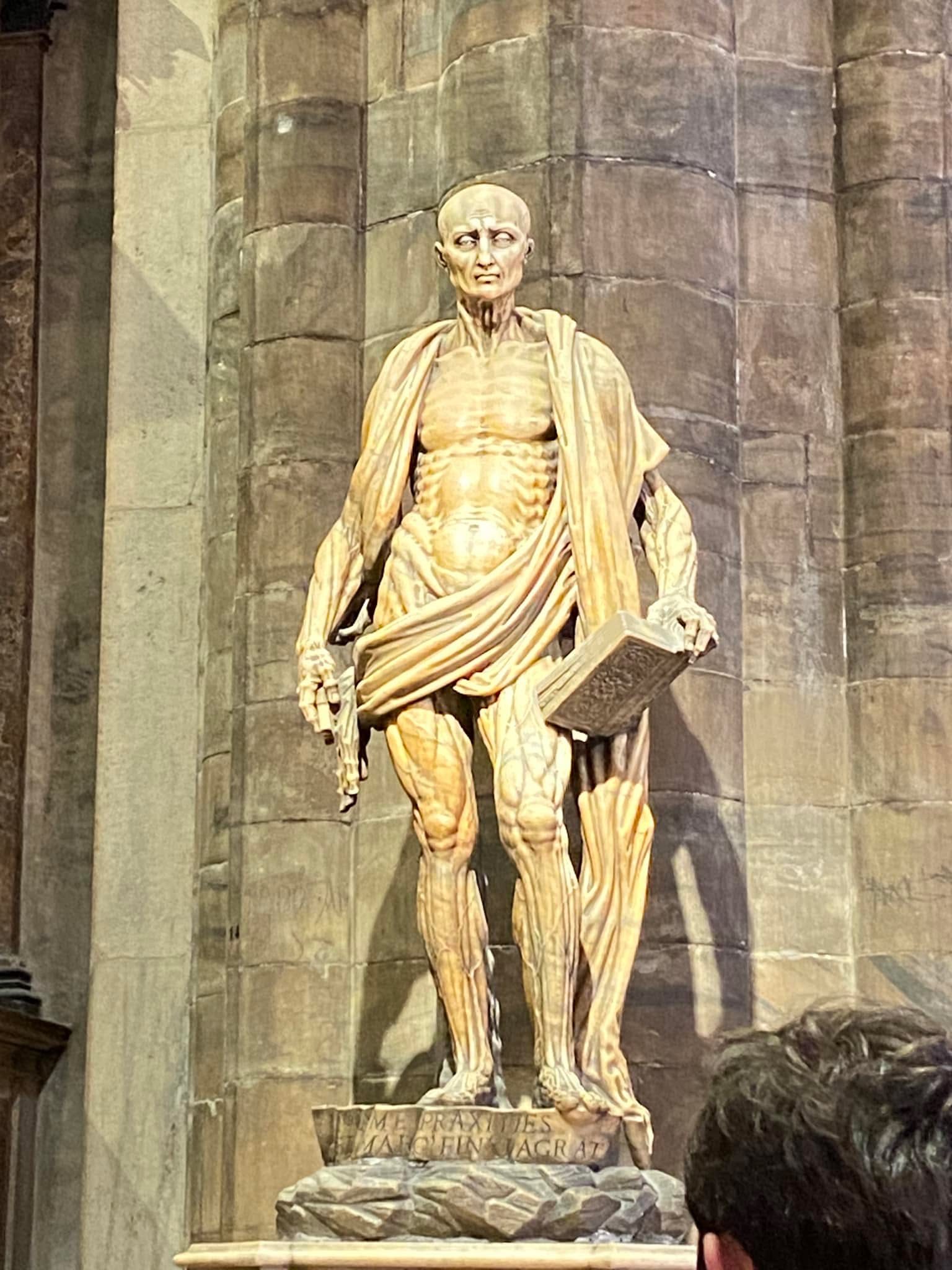 Happy feast day of St. Bartholomew. This statue of him is the most famous work of art in the Duomo di Milano. It is believed he was flayed and beheaded for converting the King at that time in Armenia to Christianity. He is depicted here holding his own skin. Despite opposition and persecution he was not duplicitous and held on to the truth in the teachings of Christ. St. Bartholomew pray for us?