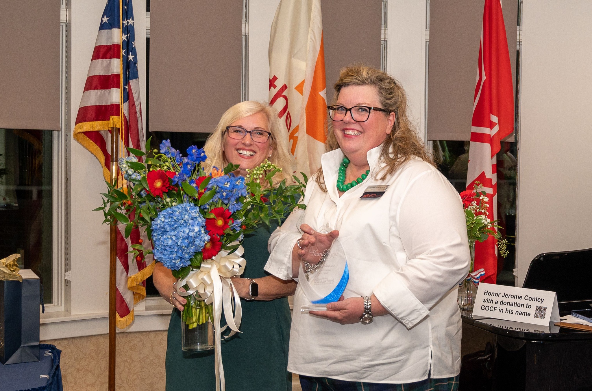 The Greater Oxford Community Foundation extends very special appreciation to outgoing board member Heather Monson.
Heather served three 3-year terms on the Foundation board, and during those nine years, served in almost all the Foundation roles available: Vice President for two years, Chair of the Advancement and Publicity Committee for eight years, plus serving on Special Events, Paving the Way, and Grants Committee.
Heather was honored November 6 by the board and community at our Foundation Celebration, with flowers and an award. She will have a brick engraved with her name and years of service in the Uptown Parks.
Thank you Heather, for honoring us with your time, talent and treasure, as well as your ongoing creativity and advocacy!
#grantmaking4good #greateroxfordcommunityfoundation #givewhereyoulive #pavingtheway
Pictured: Betsy Hope (left), Heather Monson (right)