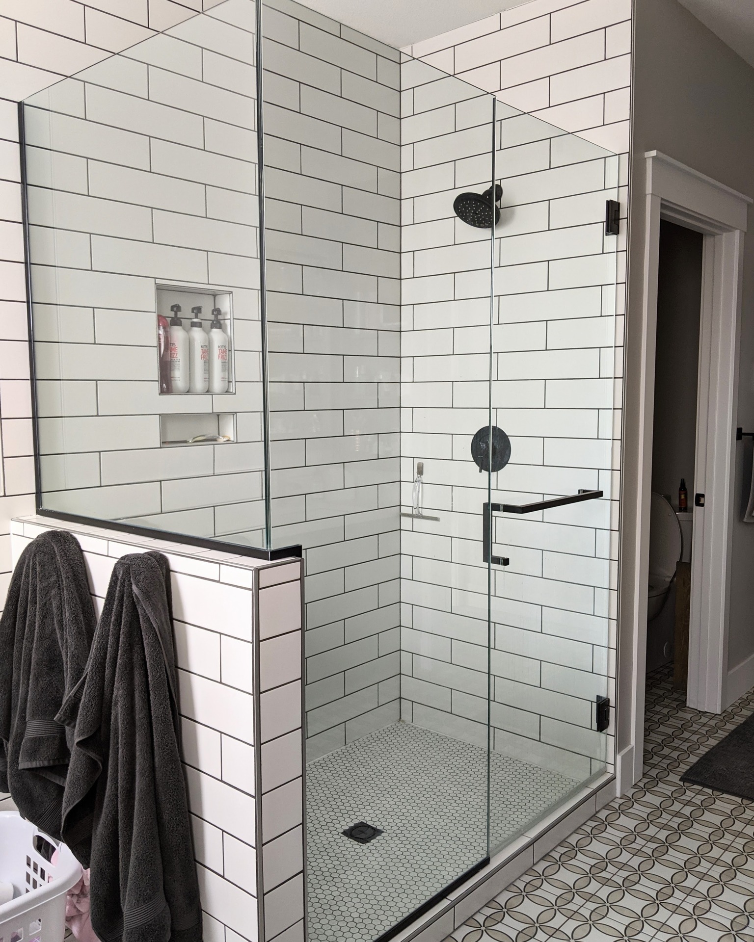 Coming up with tile inspiration can be challenging. Mixing patterns and sizes are a great way to avoid your room looking boring and harsh. Our suggestion for mixing your tiles:
1. Pick a larger tile on the walls
2. Pick a medium sized tile for the floor that is a different shape than your walls
3. Pick a small tile for your shower floor (this also helps sloping towards your drain)
4. Be aware that your installer may not like this, but you can be confident it will look GREAT afterwards! Especially if you hired Liliidae to create your room for you ?
If you want to know what we can do for you, head to