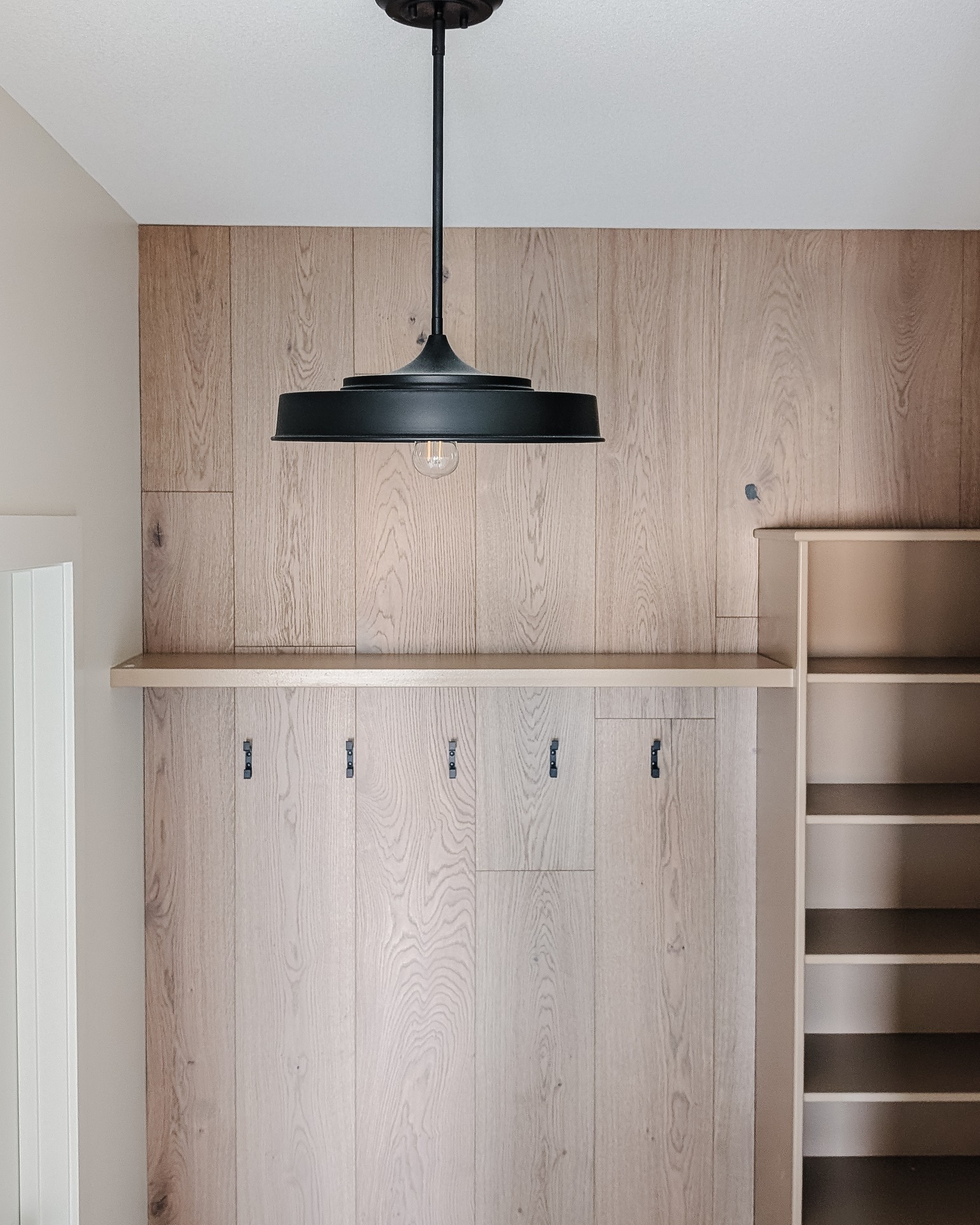 An entryway needs a lot of things to function well; storage, hooks, a place to sit down and tie your shoes, shoe storage, resilient flooring and good lighting. Win win if you can also make it all look as good as the garage entrance in our #lhdmochabungalow
#liliidaehomeanddesign #saskatchewanhomes