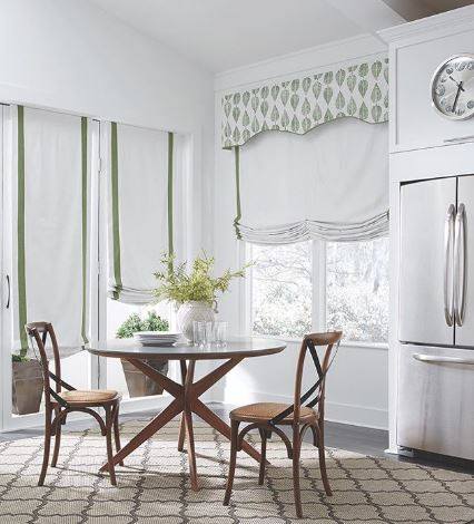 Ready to take your windows from simple to spectacular? The secret is in the layering!
By combining different treatments, you can add incredible texture, dimension, and customized style to any room. This kitchen breakfast nook is the perfect example, featuring a beautiful combination of textures and tailored details that create a sophisticated, lived-in feel.