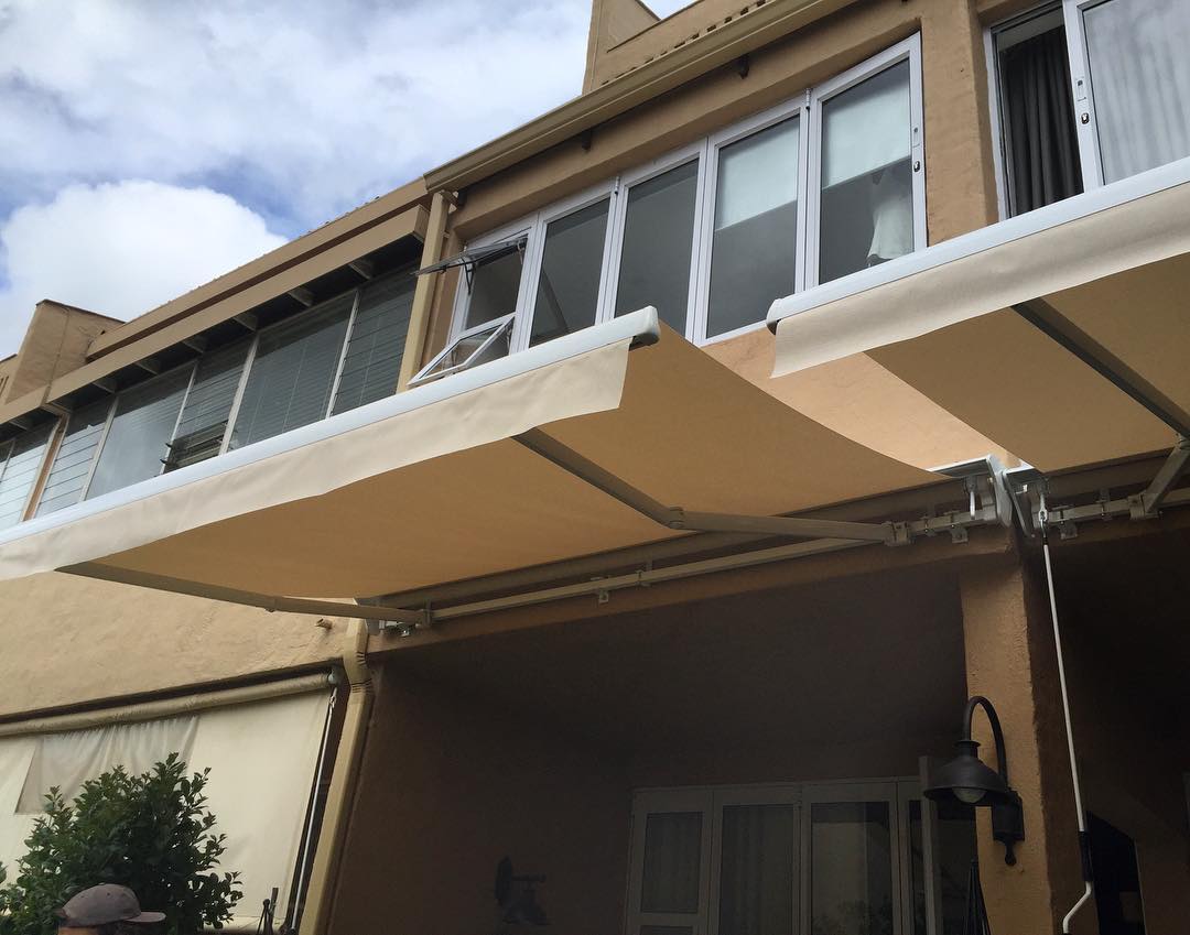 Patio fold arm awnings