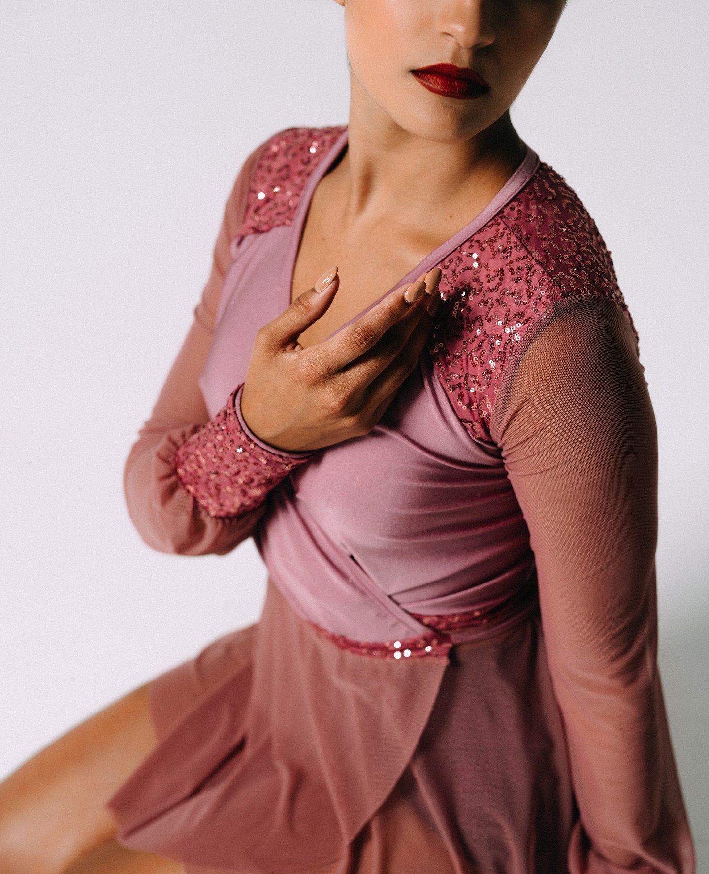 The Gia Wrap dress has a gathered lycra bodice with sheer mesh blouson sleeves and sequin details. It is light and airy with a great fit. Choose from unique prints or you can customize your look in any of our 17 solid colors.