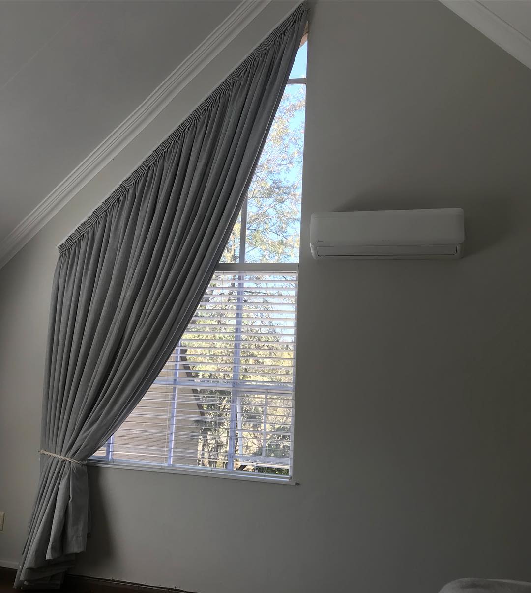 Slanted windows are tough but can be done! We think this turned out beautifully #hertex #curtains #interiordesign