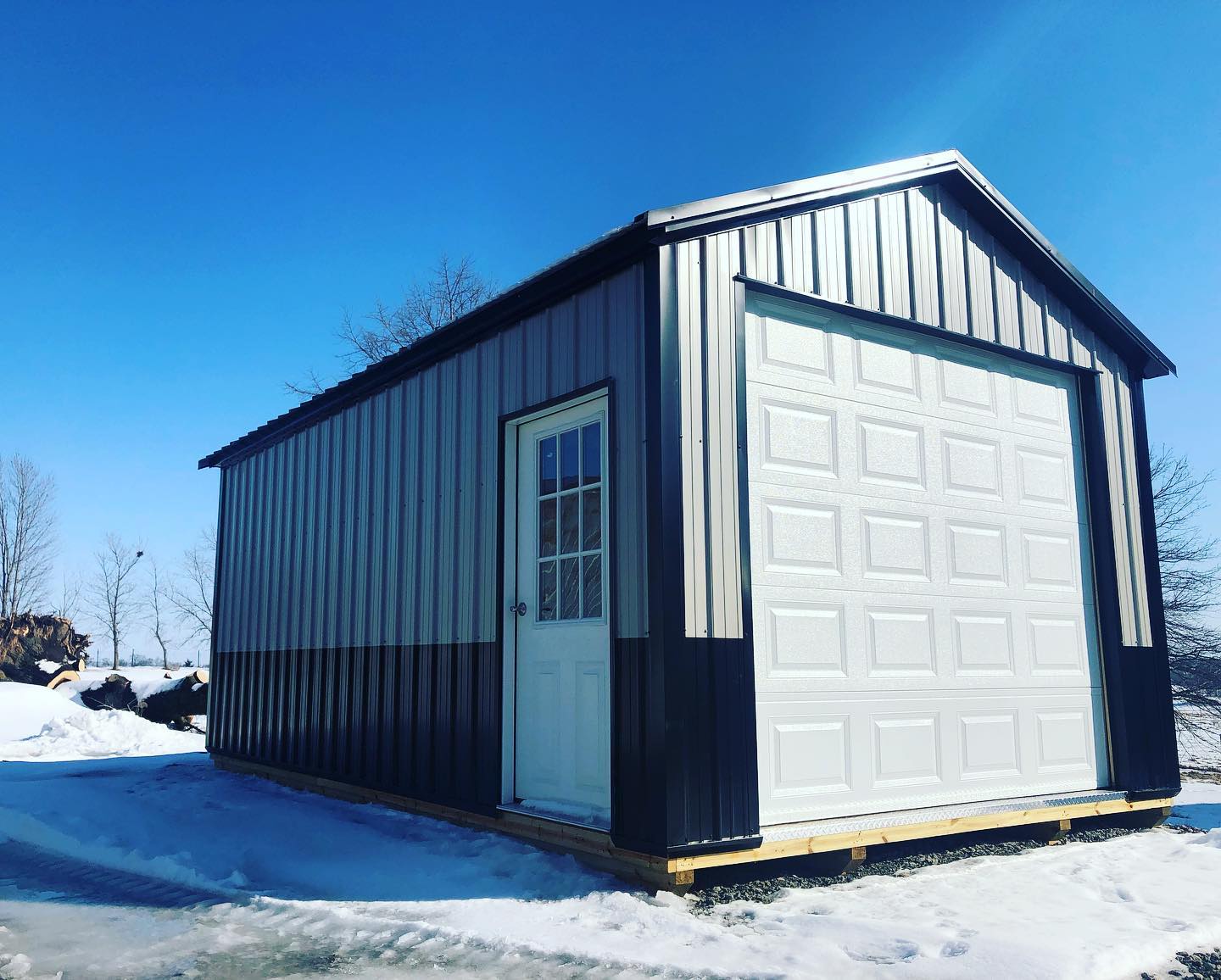 Finished this 12x22 portable garage with wainscoting! This one will be staying on the property to be used as a storage shed for trim and other items that can easily clutter up the main shop. Feel free to stop by and take a tour! #shed #garage #mancave #sheshed #portable #backyard #kalona #iowa #amishcountry
