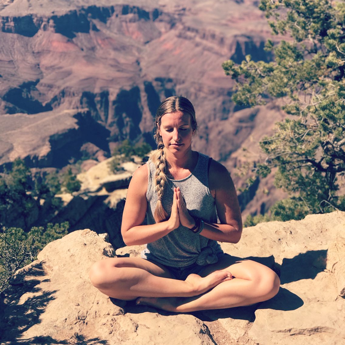🧘🏼♀️J U S T S I T🧘🏼♀️ When I’m not sitting on the edge of the Grand Canyon to take a ridiculous photo, I’m sitting on the edge of a folded blanket to take care of my body. 🙃
-
Siddhasana or “Accomplished Pose” is said to be the most distinguished of all Yoga poses. This ancient, seated posture is traditionally used for long periods of meditation and pranayama (breathing exercises). -
Sitting on a blanket or bolster or even a block can help make sitting more comfortably by lifting the hips above the knees. Finding the right amount of height with your prop can make all the difference in sitting up straight with more ease. 😎
-
Start by sitting with legs out in front. Then bend one knee and place your foot in towards the groin. Then bend the other knee and place that foot either in front of or on top of the other.
-
Maybe you choose to sit again a wall for support. You could even add blocks under the knees. Set yourself up for success. Allow yourself to sit up tall, shoulders relaxed, corners of the mouth turned slightly upwards. 🙂
-
I suggest doing some gentle hip opening before coming into Siddhasana. And if you’re still feeling that your hips are too tight for this pose, try Sukhasana (Easy Pose) with legs crossed instead.
-
And then, just sit. That’s it. While here maybe you choose to do the 5-4-3-2-1 exercise I mentioned yesterday. -
Take a big breath in feeling a lightness through the chest. As you exhale, really root down into your prop, into your mat, into the earth. Our root chakra is located at the base of the spine. It is associated with the earth element and our ability to dig in, to feel firmly rooted. May we be firmly rooted in this pose and in our lives.
-
#siddhasana #sukhasana #accomplishedpose #easypose #grounding #groundingtechniques #rootchakra #muladharachakra #rooting #yogaoutside #yogaeveryday #yogainthegrandcanyon #yogainthecarribean #stcroix #stcroixusvi #justsit #openhips #openheart #alwaysuseprops