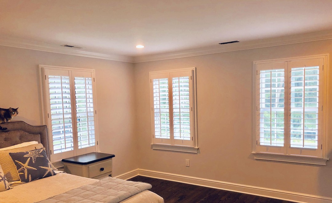 Trying to figure out the best window treatment options for your bedroom? Check out how well our shutter options look in this room! After 50 years in the business, we know our stuff. ⠀
•⠀
•⠀
#plantationshutters #windowtreatments #50yearsinbusiness