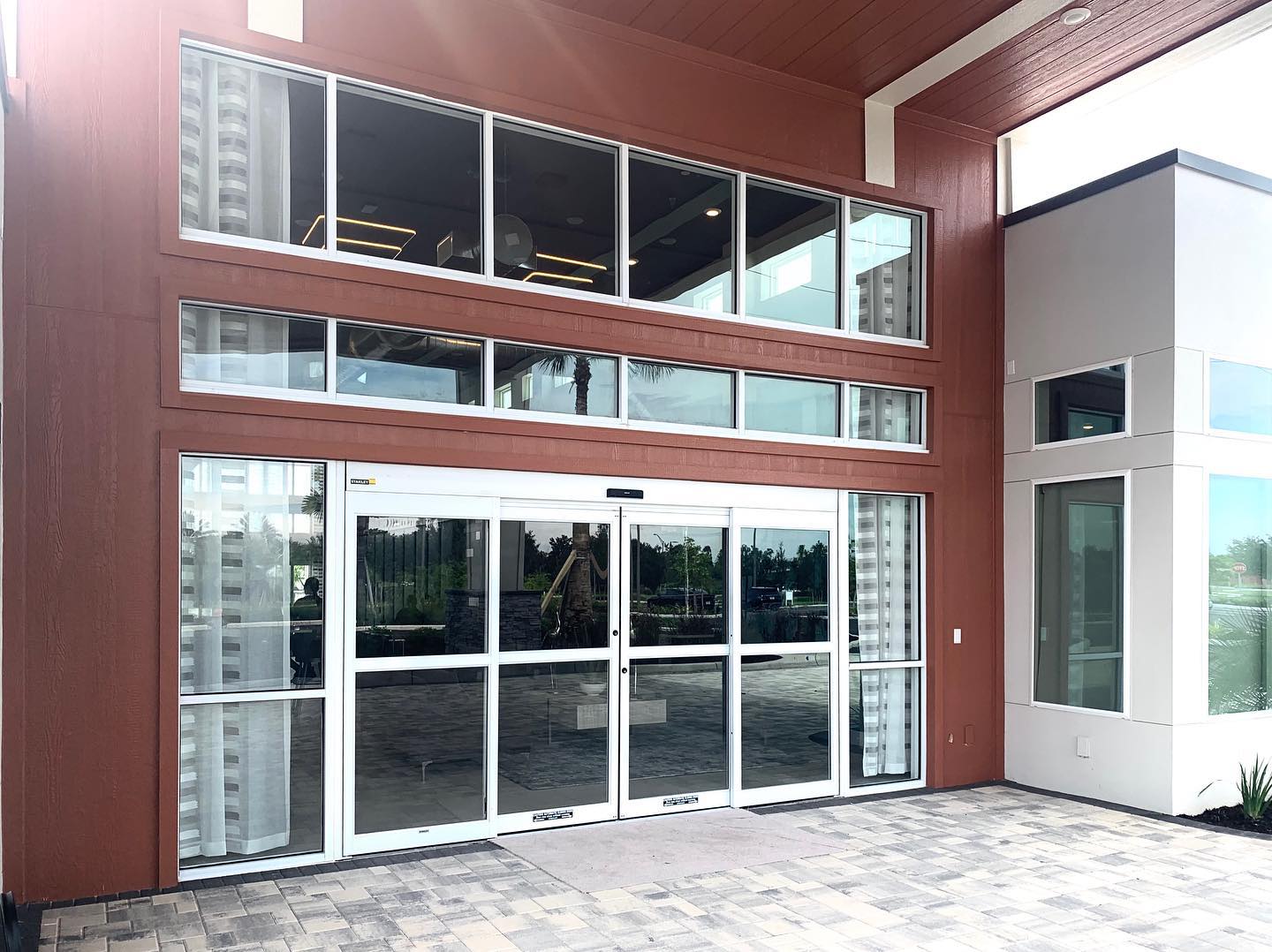 Spectacular Finish at Reunion: Spectrum Clubhouse. Storefront Windows and Automatic Door installation by @aluminateglassfl