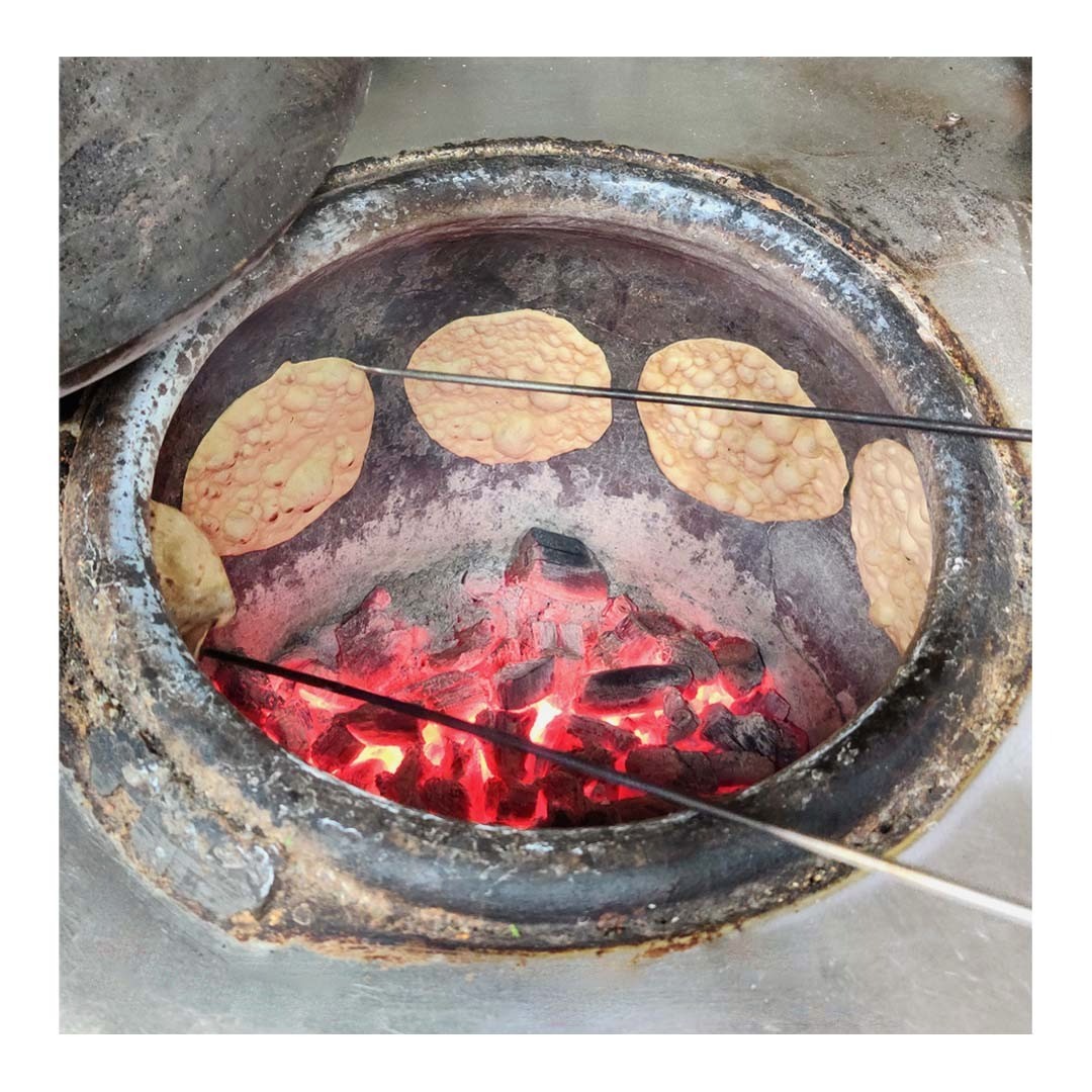 Tandoor
.
Object / Domestic
.
A Tandoor is a cylindrical oven made of clay or metal to bake and cook food. Tandoors have been used since the time of pyramids and throughout Western, Central, and Southern Asia. Tandoor ovens expose the food to direct fire and smoke, thus giving a distinct smoky flavor to the food.
Tandoor oven usually uses wood and charcoal as fuel. Curing a new tandoor oven is one of the crucial steps in ensuring its quality and longevity. This process involves starting a small fire and slowly increasing the temperature to its maximum level. This will ensure that the tandoor is ready for usage.
Different countries have different kinds of Tandoors based on the type of food they are cooking. Few tandoors are even built underground for this purpose. Food cooked in tandoors doesn't use much oil and spices and brings out the food's original flavor. The food is usually cooked in its own fat, thus removing excess fat and rendering it healthier.
Photography @raksha_raman
.
.
EDA is a crowdsourced archive of Everyday design from the Indian Subcontinent.
Follow @everydaydesignarchive for more.
.
.
.
.
.
.
.
.
.
.
.
.
.
.
.
.
.
.
.
.
.
.
.
#design #everyday #dailyobjects #designerobjects #homemade #artisanal #craftsofindia #artistsofindia #designarchive #indiansubcontinent #india #productdesign #householdobject #everydaydesignobjects #tandoorioven #indianfood #charcoalfire #charcoaloven #tandoor #charcoaltandoor