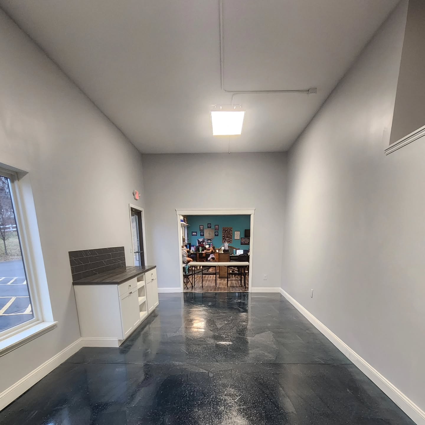 We are wrapping up a studio expansion for @spacitydance this week. A new office with a custom barn door, new walls for a separate dance studio in the back, new parents area, custom cabinets and counter space with a black stained butcher block counter and backsplash, added a new window, 3 new doors, created a new opening into the new studio, painted and finished with an amazing epoxy floor.