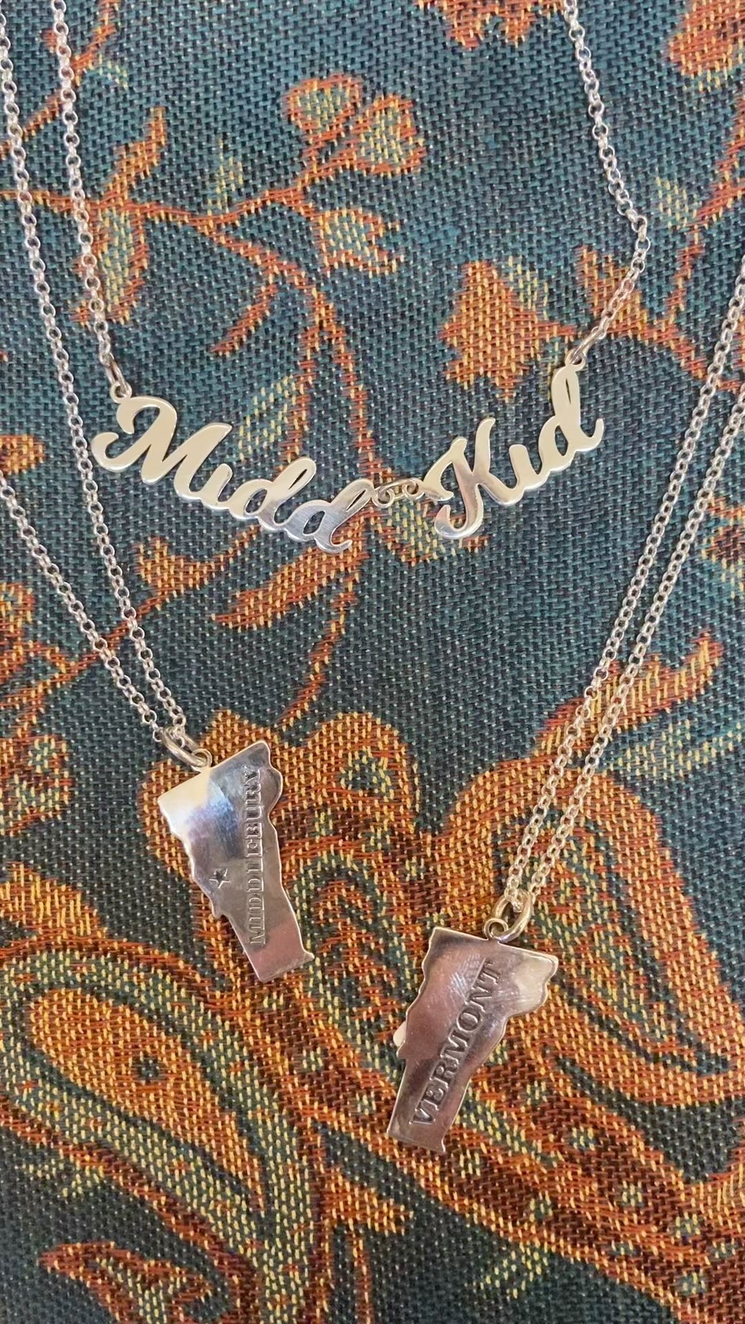 Sterling silver pendants that say Vermont or Middlebury or Midd kid! Perfect graduation gift for high school or college chains are included very beautiful and a real keepsake to remember time spent in Vermont. We ship!#Vermontjewelry #mainstreetmiddlebury #womanownedbusiness #vermontlife #middleburycollege #experiencemiddlebury #sterlingsilverjewelry #graduation #gradgift