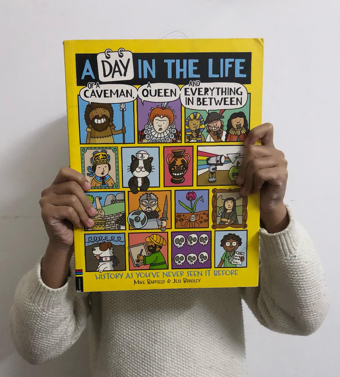 A Day in the Life of a Caveman, a Queen, and Everything in Between
By Mike Barfield and Jess Bradley
History and graphic novels—two things we absolutely love—come together brilliantly in this engaging and often laugh-out-loud nonfiction graphic novel.
Divided into Ancient, Middle, and Modern Ages, the book offers a fun and fascinating overview of major historical events while sprinkling in quirky and unexpected tidbits. The clever writing keeps things fresh and far from boring, and the chronological layout of events is both informative and entertaining. Some pages are so hilarious, you’ll find yourself flipping back to read them again!
History is a subject brimming with potential for entertainment, yet traditional teaching methods have often made it feel dull. This book flips the script, making history come alive in a way that’s sure to captivate readers of all ages.
Perfect for kids aged 6 and up, this is a must-have for anyone looking to learn, laugh, and love history!