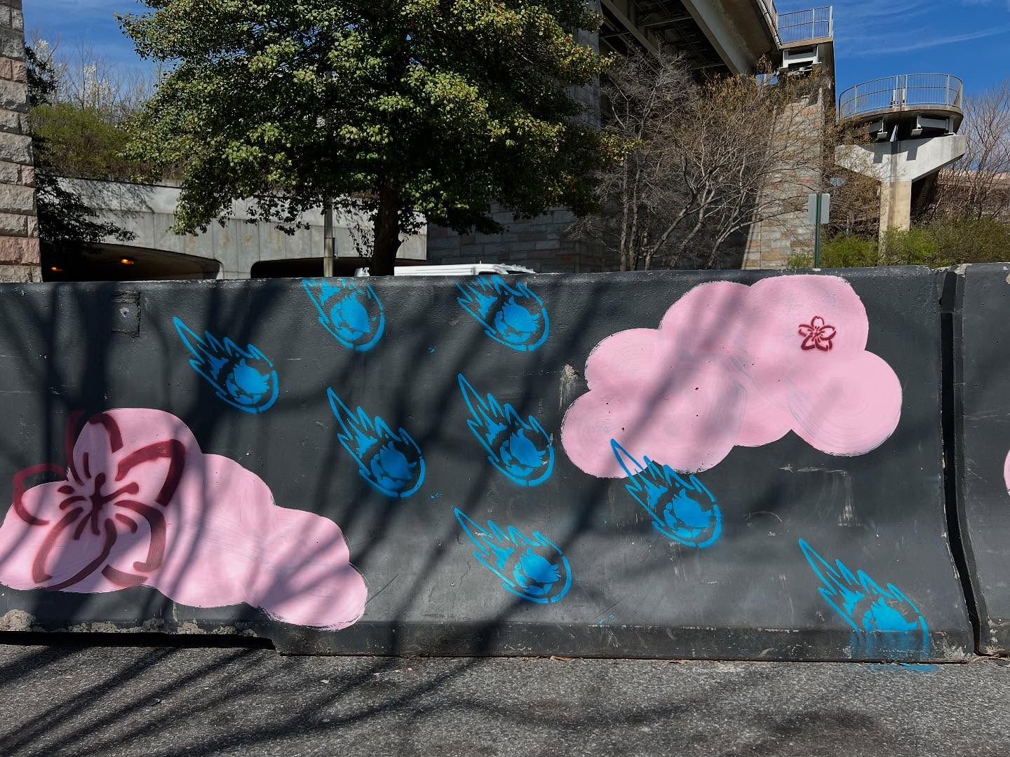 🌸 Public art meets public space!
I’m so excited to share my latest mural:
Blossoms, Beltway, and Beyond — a 1,000-foot-long cosmic journey painted just in time for cherry blossom season in Southwest DC, in collaboration with @swbid .
This joyful piece transforms concrete barriers along a new walking + biking path connecting the Tidal Basin to The Wharf. You’ll find:
🚀 Rockets flying the DC flag
🪐 Ringed planets
👨🚀 Waving astronauts
🦀 Comet-like soft-shell crabs
All floating through pink cherry blossom clouds!
This mural combines joy and safety. I saw firsthand how path usage increased even as I was painting.
Huge thanks to @a.little.bird for helping bring this to life.
Let’s keep building places where people feel seen, inspired, and safe.
.
.
.
#PublicArt #DCMurals #CreativePlacemaking #CherryBlossomSeason
#ArtInInfrastructure #StreetArtDC #MuralArt #UrbanDesign
#CommunityEngagement #SafeStreets #SWDC #PublicSpace
#ChalkRiot #AlexanderGolobArt