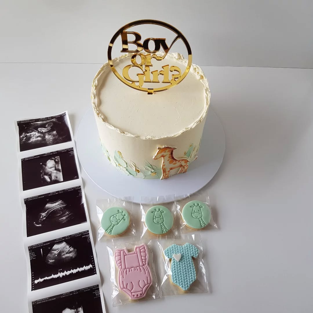 We’ve got some BIG news to share! As many of you already know, Roz and I are excited to be expecting a baby in July 2025. We had a lovely celebration with family last weekend which was a combined baby shower and gender reveal party. We were totally spoilt and of course I took the opportunity to make a baby shower cake (and some cookies) which I thought you’d like to see.
The cake was a single tier rustic buttercream cake with the soft pastel green palette knife strokes creating the perfect backdrop for the sweetest little giraffe edible image. It was finished with a touch of gold leaf to tie in perfectly with the gold acrylic cake topper. Inside was our delicious chocolate fudge cake with layers of naturally coloured and flavoured raspberry meringue buttercream. Yum!
So, I just wanted to let you all know that I’ll be taking a few months off from the end of June (to support Roz and enjoy the newborn bubble) with the plan to be back at the end of August in time for Father’s Day & RUOK? Day in September. If you made it this far thanks for reading!
Edible Image @deezeedesigns
Venue @mandoonestate
Cake supplies @cake_tinz_n_thingz
Palette knives @moreish.cakes
Colour Mint by @colour.mill
Cake topper @_etched