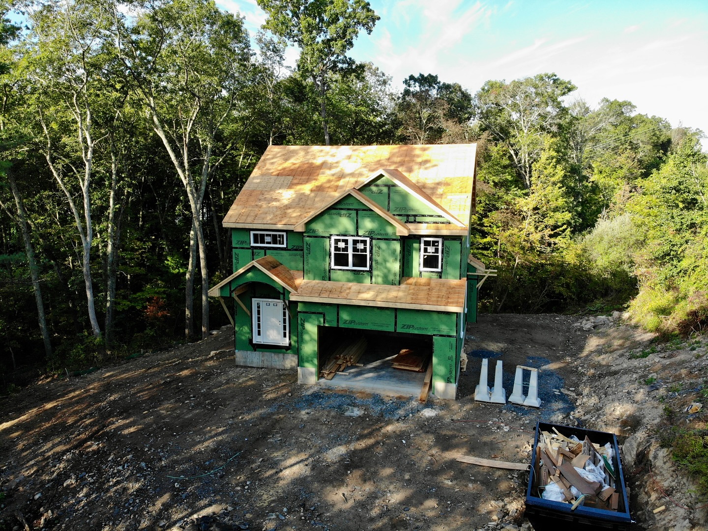 This new home in Attleboro is taking shape now that the framing is complete. Next step is roofing, decks and siding!