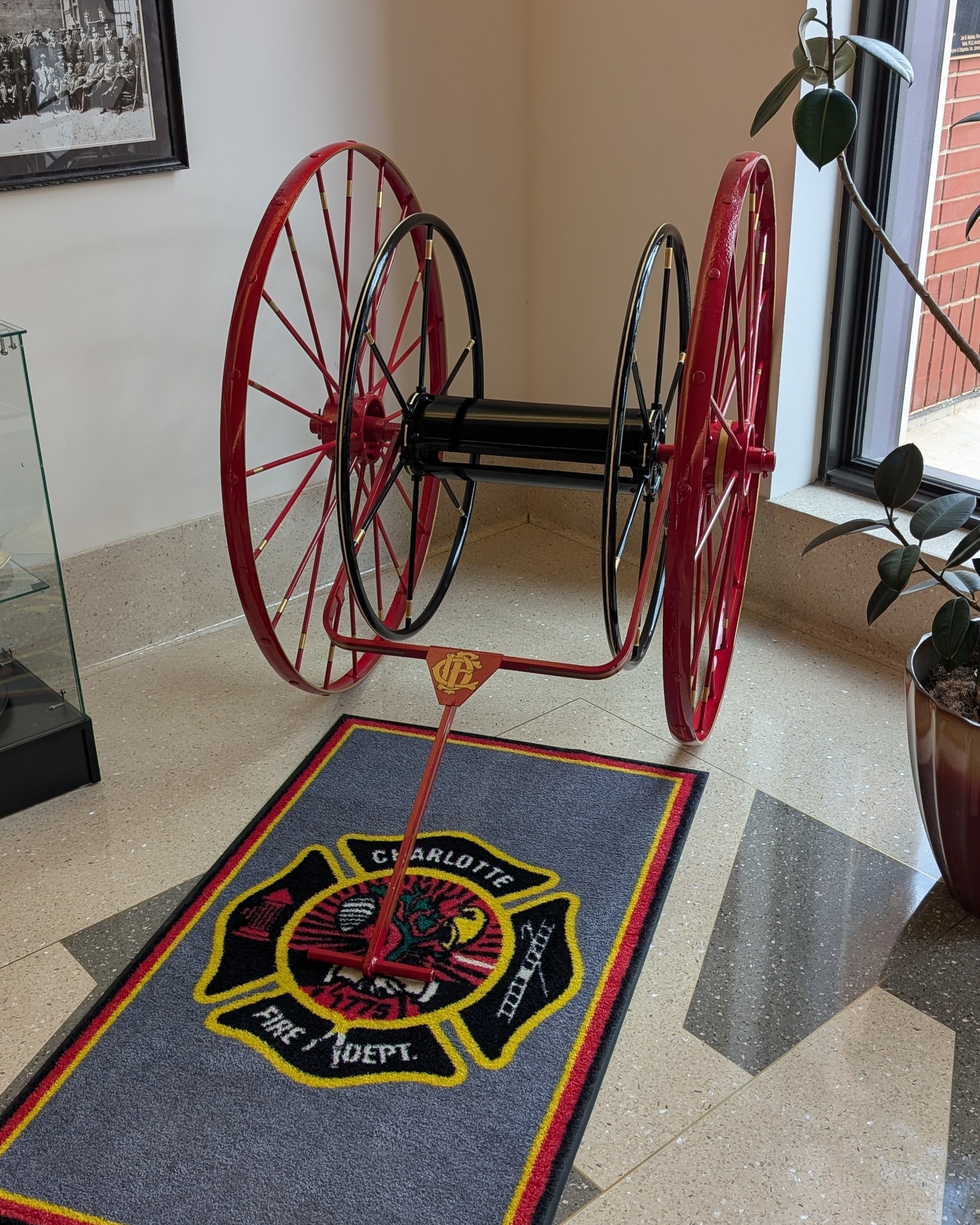 🚒🔥From Buckets to Hose Reels: A Turning Point in Firefighting
Before the days of fire engines and hydrants, firefighters relied on bucket brigades — long lines of volunteers passing water in buckets by hand. But as cities grew, so did the need for faster, more efficient tools.
That innovation came in the form of the hose reel — a simple two-wheeled cart designed to carry and deploy lengths of hose to a fire scene. Early versions appeared in Europe in the 1600s alongside leather fire hose inventions by Jan van der Heyden, but it wasn’t until the 1800s that American cities adopted them widely.
In 1804, Philadelphia’s Patrick Lyon built one of the first hose wagons in the United States — an oblong box on wheels built to carry copper-riveted hose. From that moment, hose reels became an essential part of fire service history.
🔥 Charlotte’s First Hose Reel
Here in the Queen City, the first known hose reel arrived in October 1873, when the Charlotte Observer reported that the city had approved a new reel for the Yellow Jacket Fire Company.
A year later, in November 1874, a second reel was delivered to the Pioneer Steam Fire Engine Company, ensuring both uptown firehouses could reach blazes faster and with better water supply.
These hand-drawn reels, built of wood and iron, allowed Charlotte’s firefighters to move hose through muddy, unpaved streets — a small device that made a big difference.
💪 From those early reels to the high-pressure hose systems of today, every turn of the wheel tells a story of innovation, bravery, and community service.
Check out the photos below of a restored hose reel on display at our headquarters building!
The Charlotte-Mecklenburg Fire Museum & Education Center continues to preserve our history; Honoring the past. Serving the present. Educating for the future. Please make sure to like, follow, and share our page with your friends and family!
#charlottehistory #firefightingheritage #honorserveeducate #cltfiremuseum #thenandnow #themoreyouknowthemoreyougrow
#fireequipment #hosereels #earlyinnovation