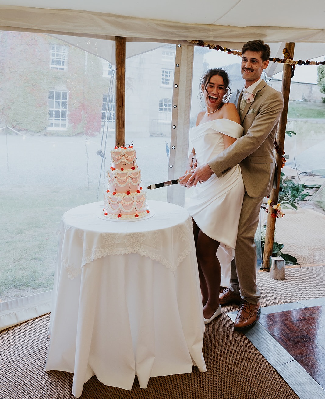 That moment every cake maker loves to see; the happy couple cutting into their gorgeous centrepiece.
For Amelia & Osh it was a fabulous Lambeth style cake; a bold, playful design in pink, with plenty of glacé cherries, and every intricate detail piped by hand.
@westcountryweddingplanner
@colehayespark
@elizabethgracefloralstyling
@adamsmarquees
@cindyrossiterphotography
@borrowthemoon
@duckandstrawberry
#sweetsatisfactioncakes #weddingcake #weddingcakedesign #weddingsindevon #luxuryweddingcake #lambethcake #pinklambethcake #colehayespark #colehayesparkweddings