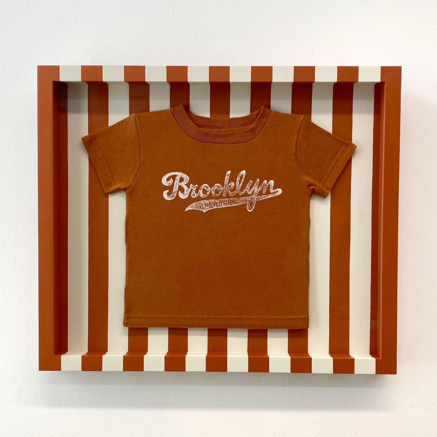 Baby Brooklyn T-shirt sewn in custom painted striped frame with mount and spacers to match, we love showcasing your special keepsakes in unique styles! ?
#JWhiteFraming #westlondongallery #westlondonframing #customframing #handfinishedframe #paintedframe #mementoframing #tshirtframing #brooklyn #brooklynnewyork