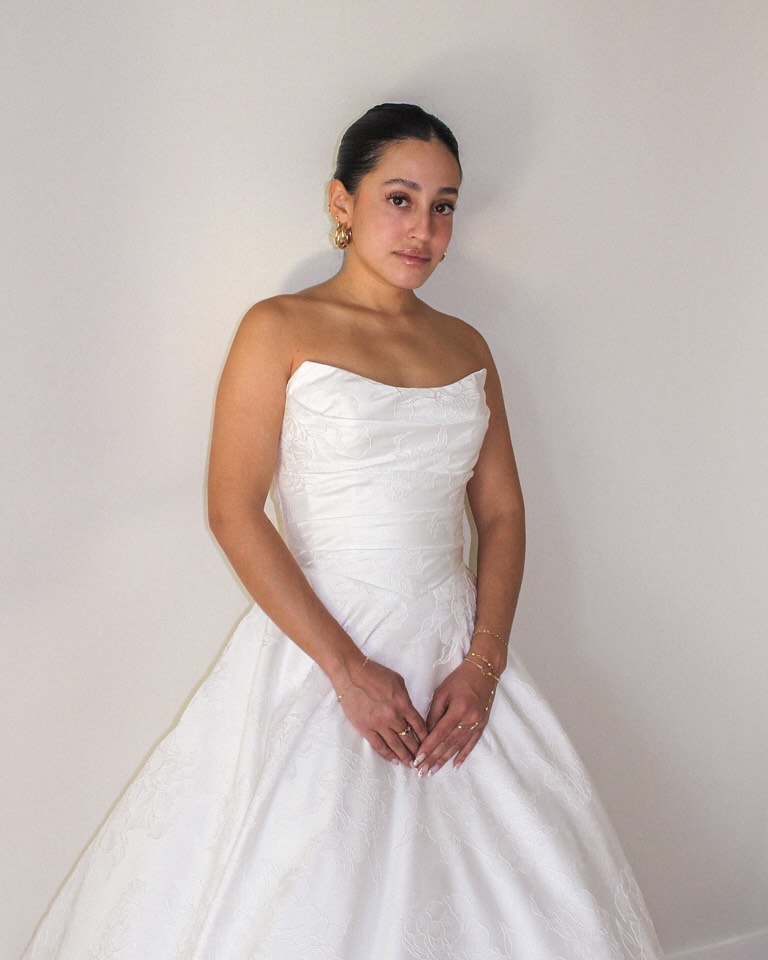 NEW: @mikaellabridal M2536, an A-line gown melding minimal simplicity & structured excellence 🤍
Be the first to wear this wedding dress sculpted with the empowering angles of a cat eye scoop neckline and basque waist bodice, softening into wrapped pleats of subtle floral jacquard fabric. Follow the link in our bio to book your appointment and shop our favorite @mikaellabridal styles and so much more! 🔗
model: @helenmohan
photographer: @nicoletta.minutella
wedding dresses, wedding gown, bridal boutique, wedding dress inspiration, designer bridal gown, bridal fashion, modern bride, bridal trend, wedding day dress, bridal couture, say yes to the dress, wedding dress shopping, 2026 bride, 2027 bride, minimalist wedding dress