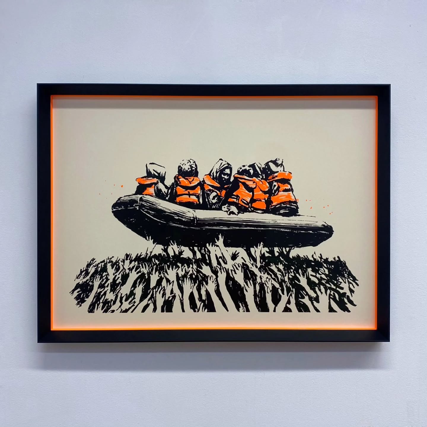 Migrant Boat (Glastonbury 2025) Banksy screen print in a black angled box frame using striking neon orange spacers
#JWhiteFraming #westlondongallery #banksy #banksymigrant #banksyglastonbury