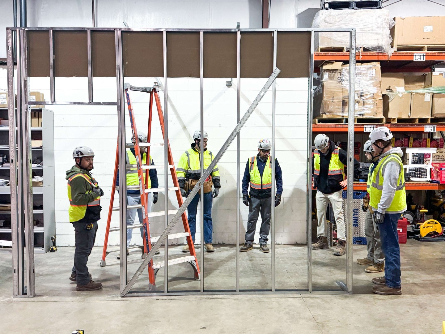 Our Summit Training program continues with hands-on learning at our Manassas warehouse! After a week of comprehensive training meeting our suppliers and learning about materials, it was time for our trainees to put their knowledge to the test and turn training into real-world framing experience.