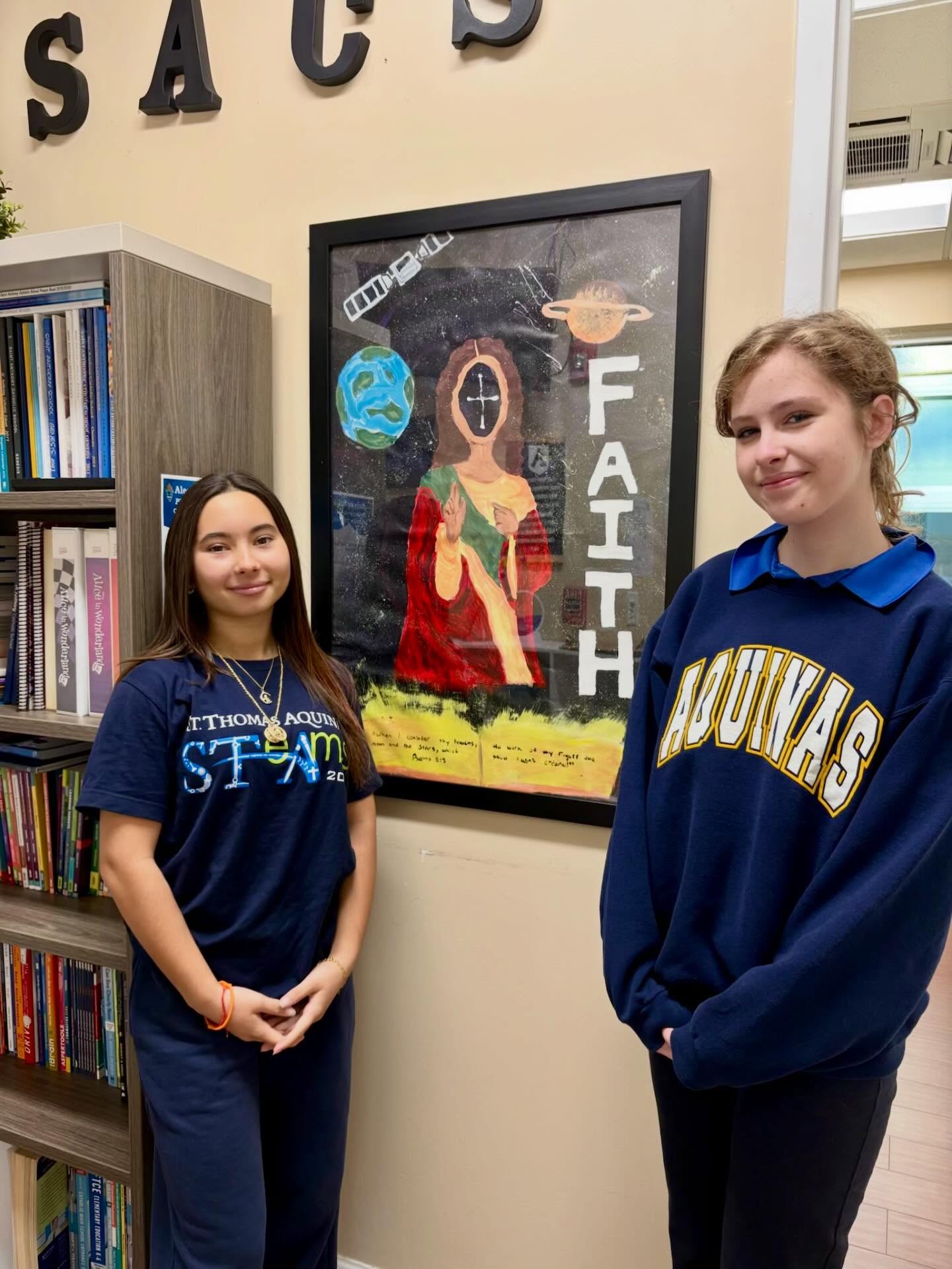 Our 8th graders, Elle S. and Sophia M., competed at the STA STeAms competition. We are proud to have their artwork hanging outside of the admin offices. Great job girls!