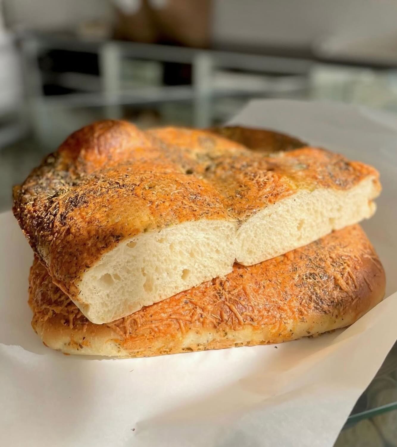 Good things really do come back around, and Focaccia Fridays are proof. While we’ve loved experimenting with new bakes, this weekly favorite left a hole in our hearts we just couldn’t ignore. So we’re kicking things off with the return of our very first recipe—Herb & Cheese Focaccia. 🌿
Our Herb & Cheese Focaccia base is the original we reference with every focaccia bake. Generously layered with Italian herbs and Asiago cheese, it creates a thick, herbaceous, ultra-savory crust with a perfectly cheesy finish every time. 🧀
Split and toast it for an herby avocado smash, bake it into cheesy pull-apart bread, or crisp it up for dunking into your favorite soup. Our Herb & Cheese Focaccia has inspired countless kitchen creations over the years, and it’s ready to spark a few new ones this Friday! 🫕
#yourlocalbakery #FocacciaFriday #mackenziesbakery #bakedfreshdaily #artisanbakedbread