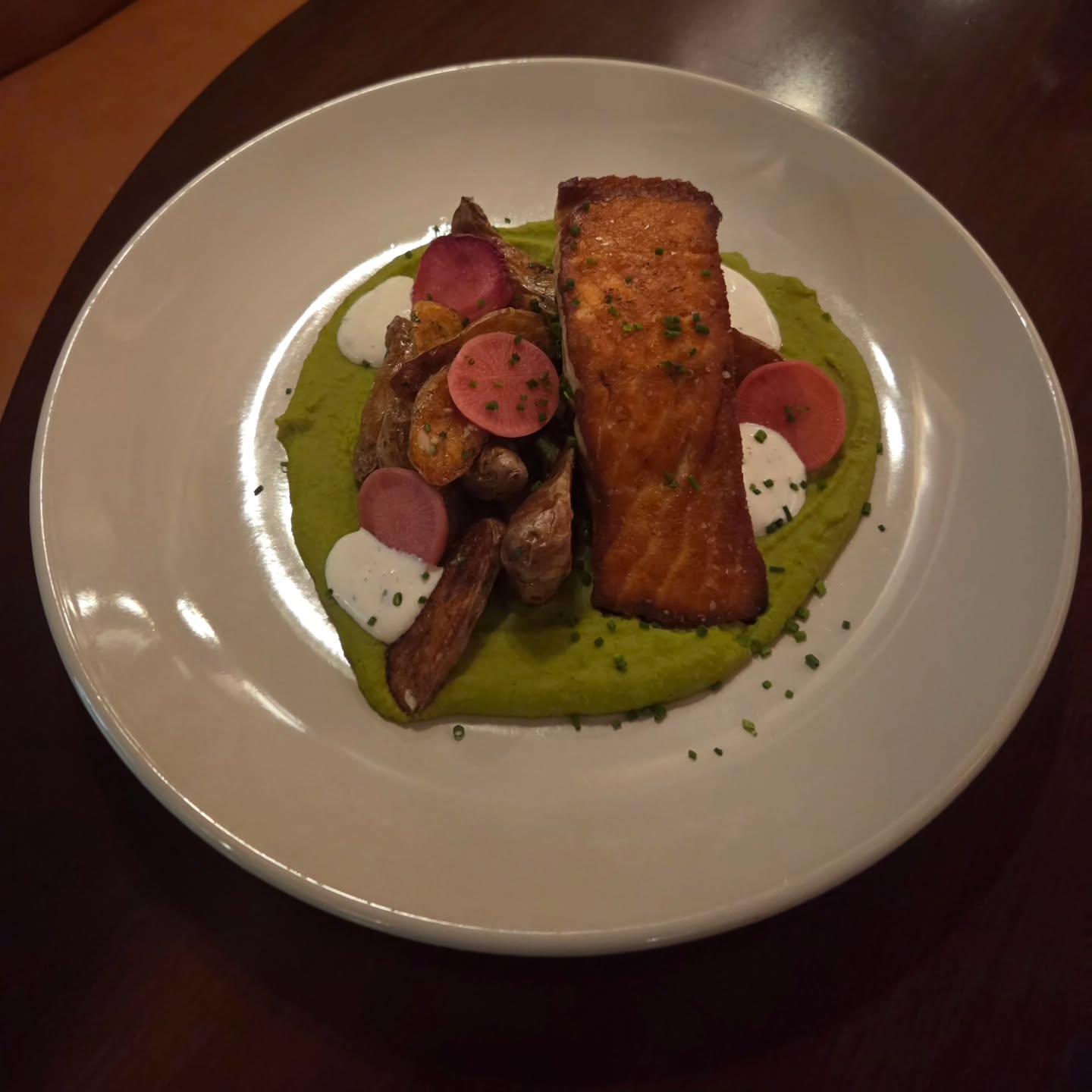 Seared Salmon with sweet pea puree, garlic butter fingerling potatoes, pickled radish and lemon parsley crema!!
Serving tonight through Saturday
5pm-9pm